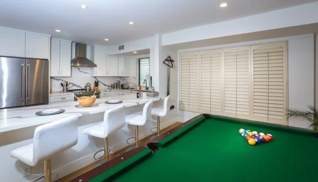 Kitchen sideway view with stainless range and refrigerator
