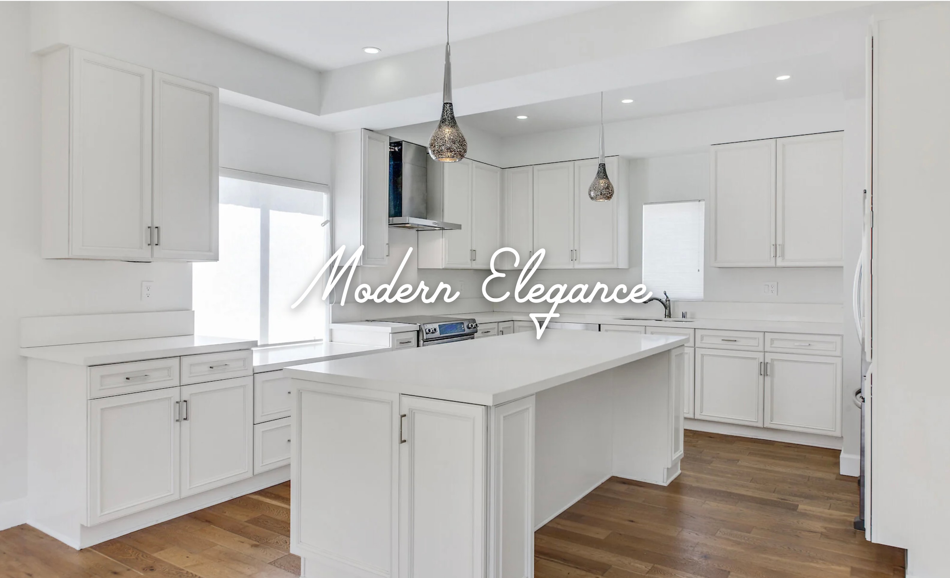 Modern kitchen with white cabinetry, island, and hardwood floors